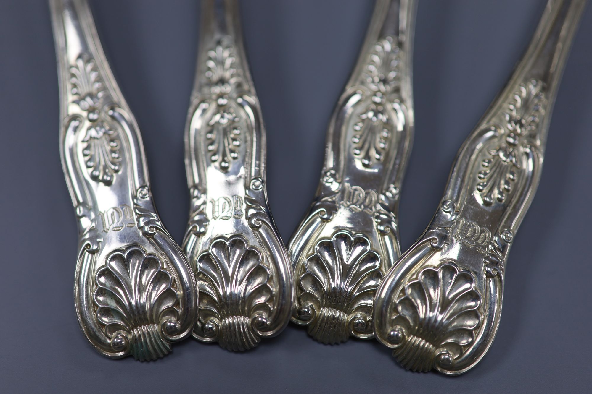 A set of four William IV silver Kings pattern dessert spoons, William Chawner II, London, 1830, 7.8oz.